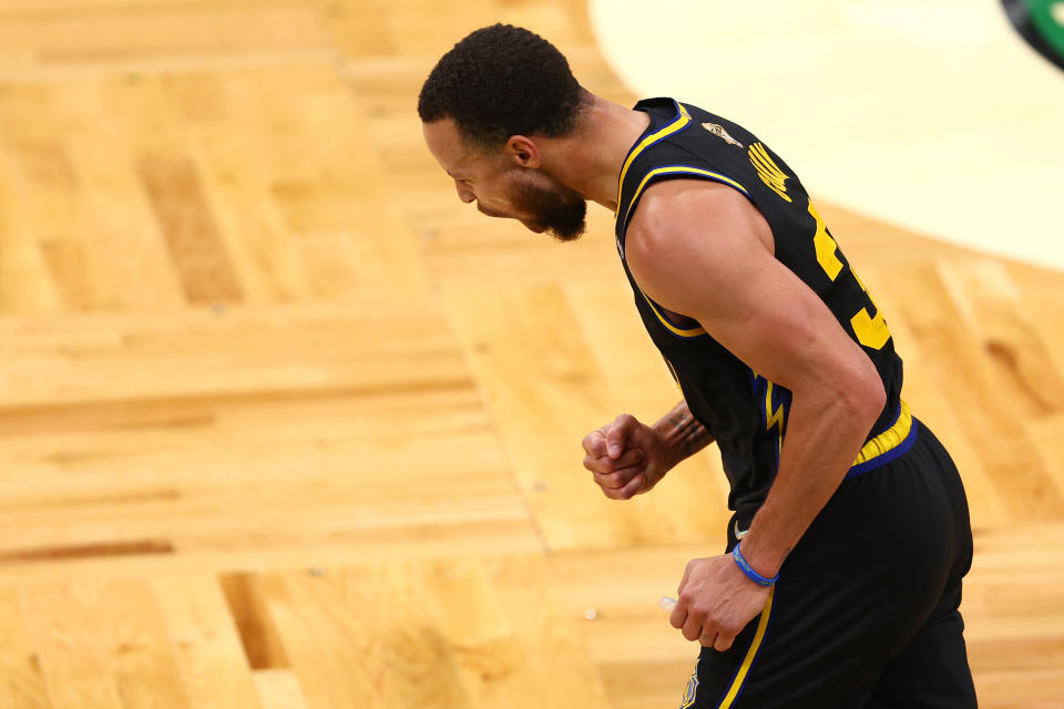 Golden State Warriors superstar celebrates during a fourth-quarter comeback against the Boston Celtics in Game 4 of the NBA Finals. (Elsa/Getty Images)