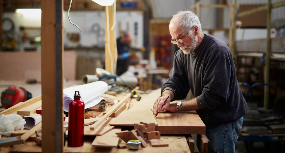 Amazon sale. man with grey hair working in shed with tools on wood, amazon canada home improvement sale