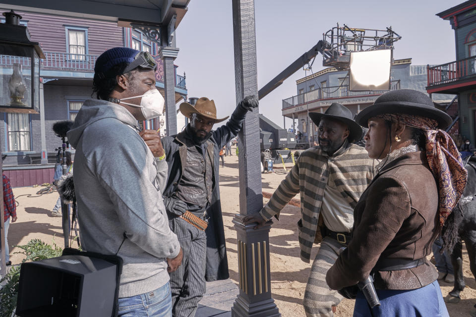 Behind the scenes, from left, Jeymes Samuel, LaKeith Stanfield, Idris Elba and Regina King. - Credit: David Lee/Netflix