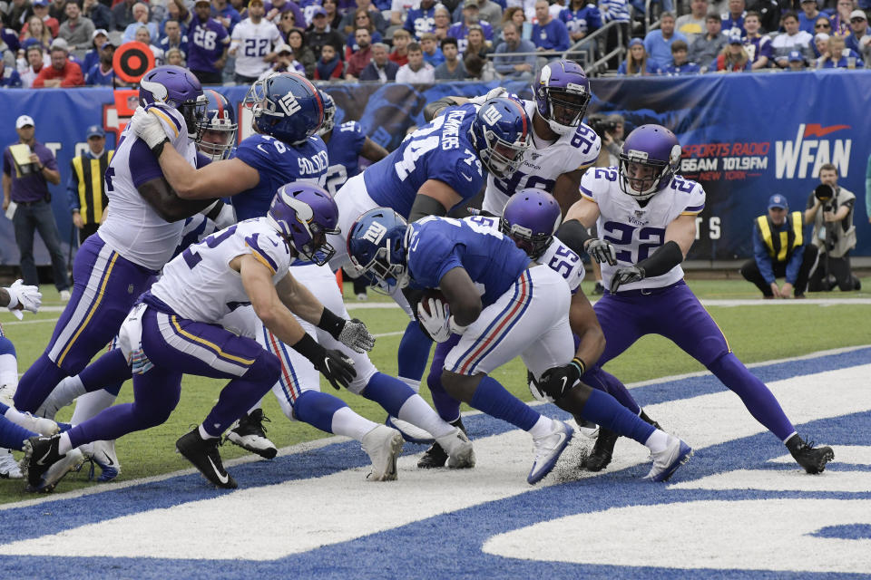 New York Giants running back Jon Hilliman (28) is tackled in the end zone by the Minnesota Vikings for a safety during the second quarter of an NFL football game, Sunday, Oct. 6, 2019, in East Rutherford, N.J. (AP Photo/Bill Kostroun)