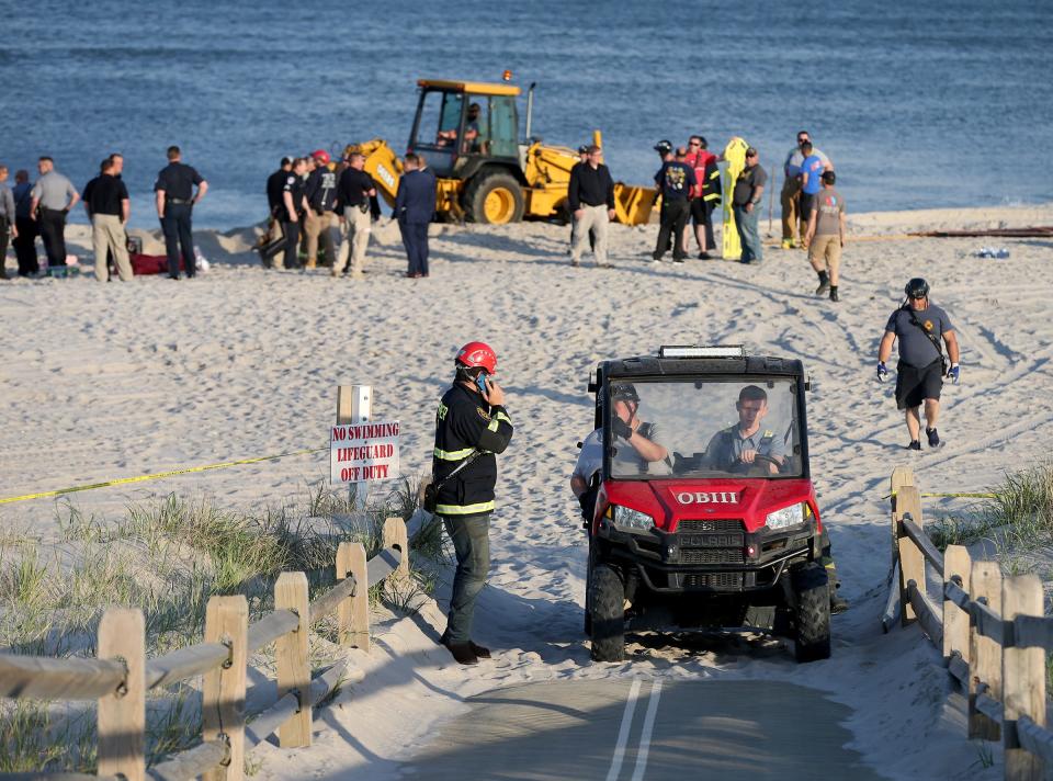 Emergency personnel leave the beach after the recovery of an 18-year-old man from Maine who was killed in a sand hole collapse at the end of East Bonita Way in the Ocean Beach III section of Toms River, NJ, Tuesday evening, May 17, 2022.  His 17-year-old sister was also in the hole but rescued.