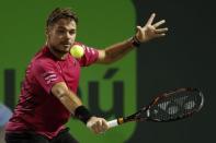 Mar 27, 2017; Miami, FL, USA; Stan Wawrinka of Switzerland hits a backhand against Malek Jaziri of Tunisia (not pictured) on day seven of the 2017 Miami Open at Crandon Park Tennis Center. Wawrinka won 6-3, 6-4. Mandatory Credit: Geoff Burke-USA TODAY Sports