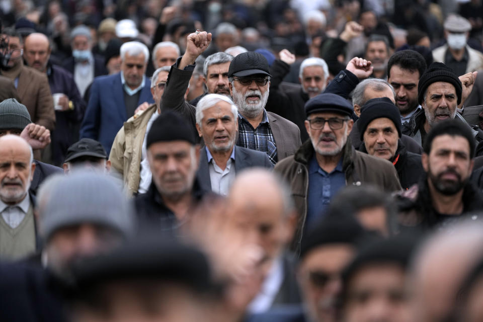 Worshippers chant slogans after conclusion of Friday prayer to show their support of Palestinians and condemning the U.S. and British militaries strike against Iranian-backed Houthis in Yemen, in Tehran, Iran, Friday, Jan. 12, 2024. (AP Photo/Vahid Salemi)