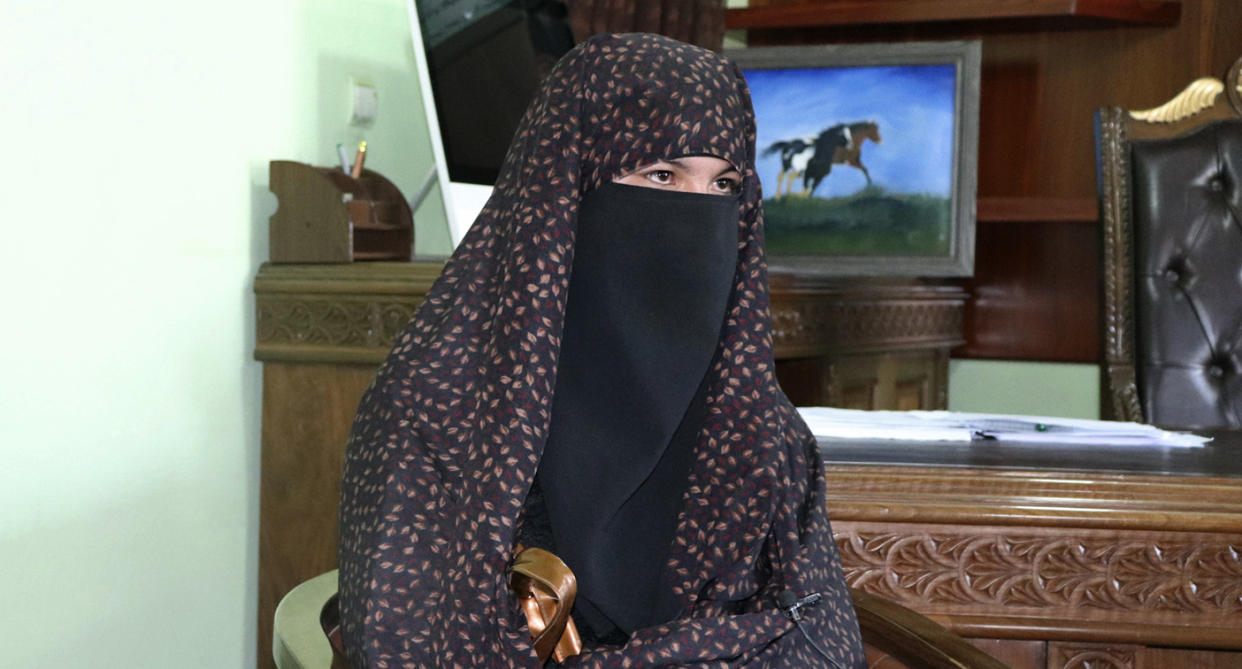 Qamar Gul, 16, right, and her brother Habibullah, 12, pose for photograph in the governor's office in Feroz Koh, the provincial capital of Ghor province, in western Afghanistan, Tuesday, July 21, 2020. The Afghan teenager and her younger brother are being hailed as heroes on social media after reportedly fighting off Taliban militants who killed their parents last week in central Afghanistan. Following the attack and the attention the incident triggered, the children are being brought to the capital, Kabul, to meet Afghan President Ashraf Ghani, possibly later on Wednesday. (AP Photo)