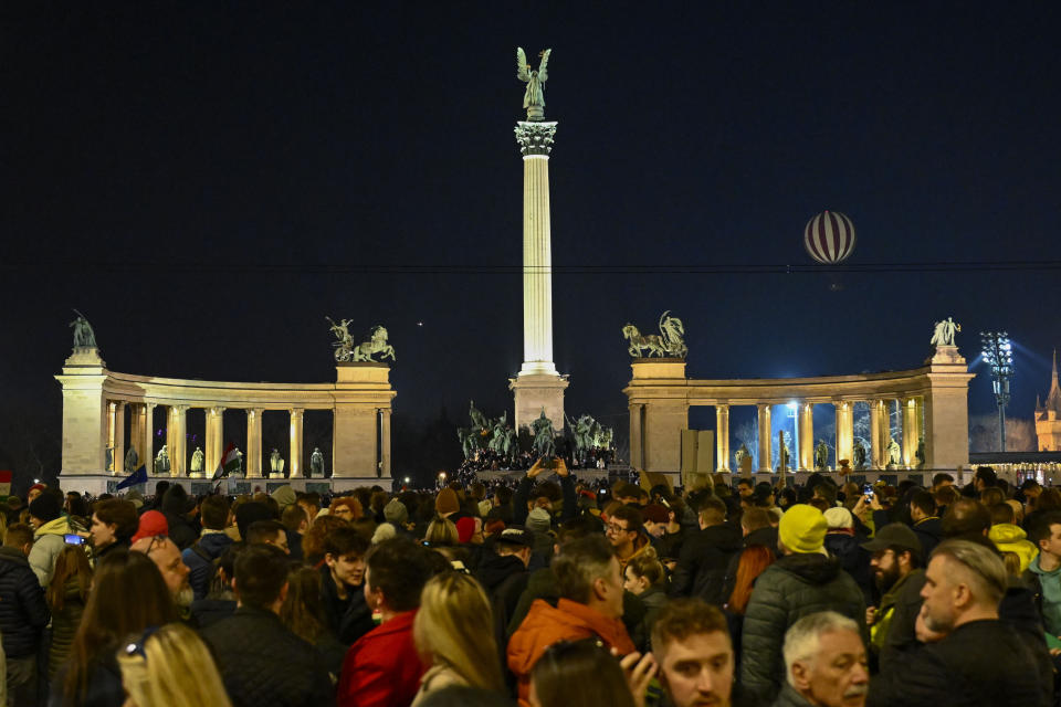 People attend a protest, at Heroes' Square in Budapest, Hungary, Friday, Feb 16, 2024. Protesters demand a change in the country's political culture after the conservative head of state resigned amid scandal over a presidential pardon. (AP Photo/Denes Erdos)