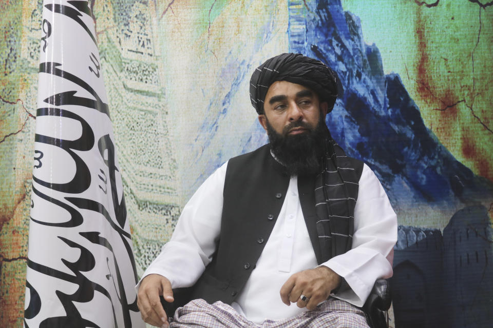 The Taliban's spokesman, Zabihullah Mujahid, sits during an interview in Kandahar, Afghanistan, Monday, Aug. 14, 2023. On the second anniversary of their takeover of the country, Mujahid said the Taliban will stay in power for a long time - and for as long as God wants. (AP Photo/Abdul Khaliq)