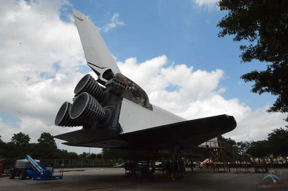 The exterior of the replica shuttle Independence at Space Center Houston is receiving a new skin, including the replacement of the numbered heat shield tiles that line its underbody. 