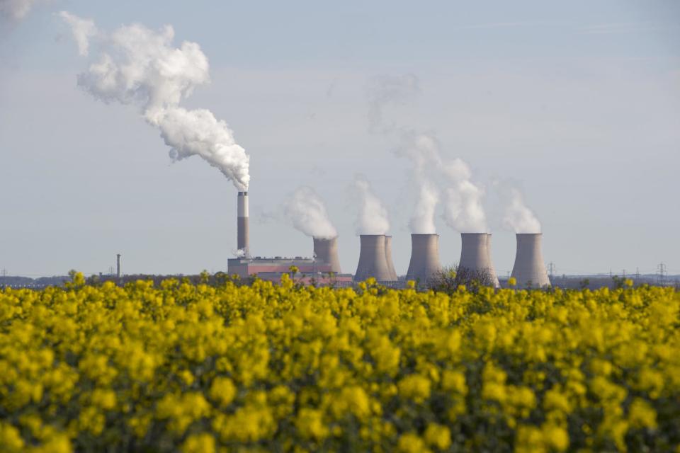 Smoke rises from the cooling towers of Cottam coal-fired power station, near Darlton, Nottinghamshire: AFP/Getty