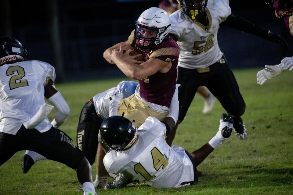 Cole Hayes of Riverdale is tackled by Curvitch Petion of Golden Gate during their spring football game on Wednesday, May 24, 2023, at Riverdale High School in Fort Myers.