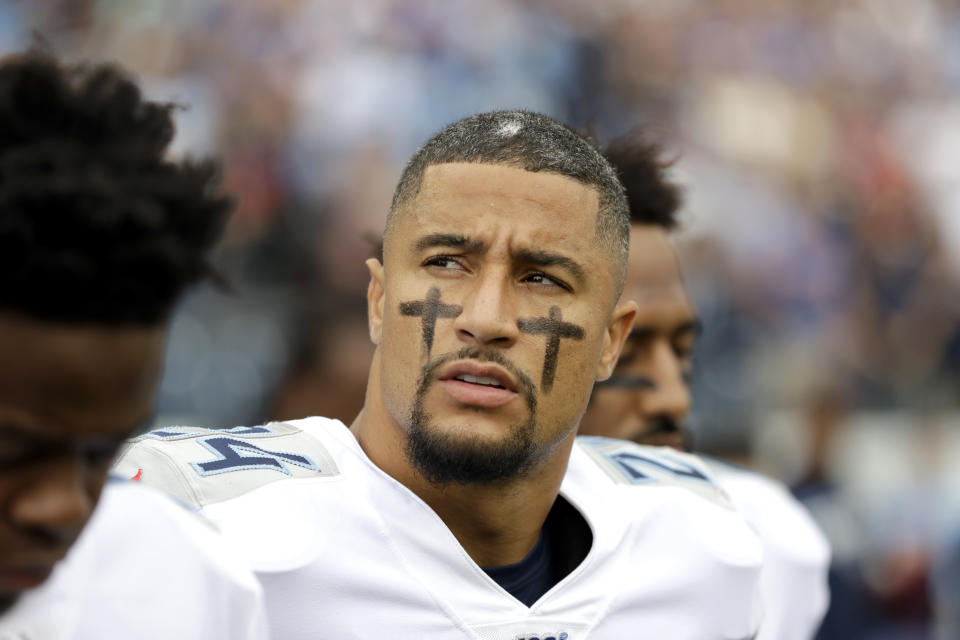 FILE - Tennessee Titans strong safety Kenny Vaccaro stands during the national anthem before an NFL football game against the Buffalo Bills Sunday, Oct. 6, 2019, in Nashville, Tenn. While its Super Bowl commercial appearances are few, religion – Christianity especially – is entrenched in football culture.(AP Photo/James Kenney, File)