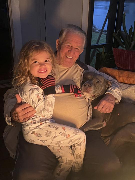 Gary Drake and his youngest granddaughter Azalee Drake, 5, pose for a picture on Jan. 4, 2024, in Jacksonville, Fla. Drake's son Mitch Drake flew to Oregon with his father in February, where physician-assisted death is allowed for out-of-state patients who are terminally ill and meet certain requirements. He thanked him for the life he'd given him, and they said their goodbyes. (Courtesy of Mitch Drake via AP)