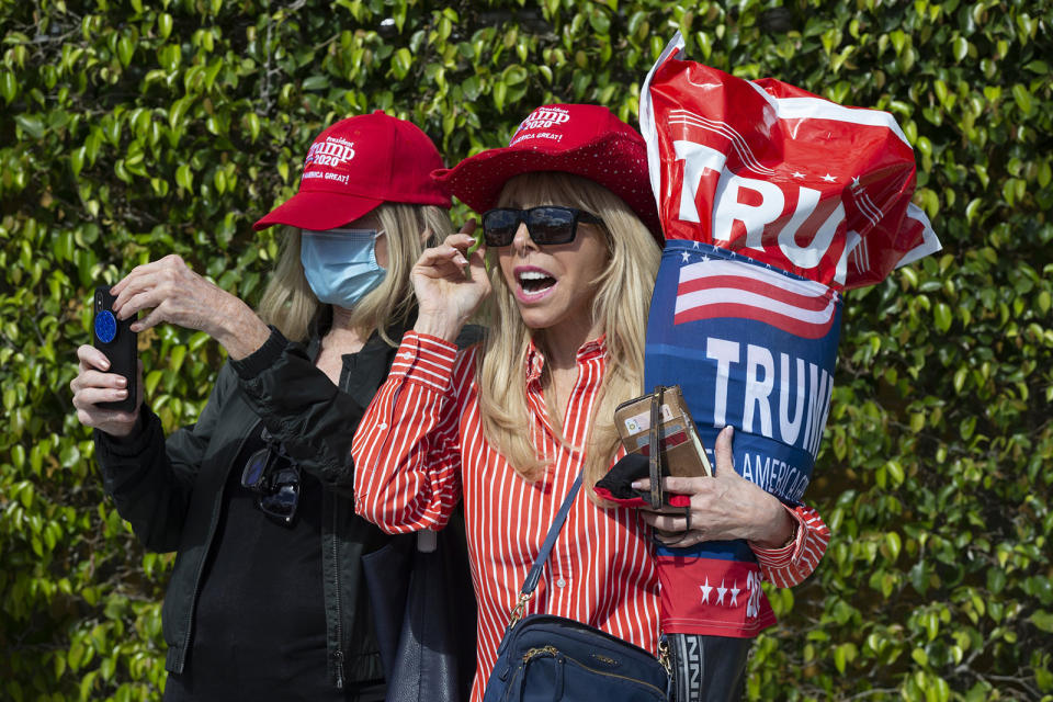 Janie Noble Simon shows her support as US President Donald Trump arrives in his motorcade in Mar-a Lago. Source: AAP