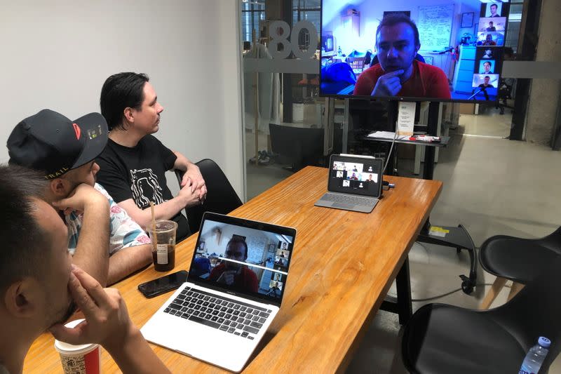 Hax's engineers discuss a prototype with the team from Unicorn Bio over a video call from their office in Shenzhen