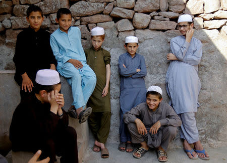 Students wait for prayer time to perform ablution at the Al-Nadwa Madrassa in Murree, Pakistan, October 24, 2017. REUTERS/Caren Firouz