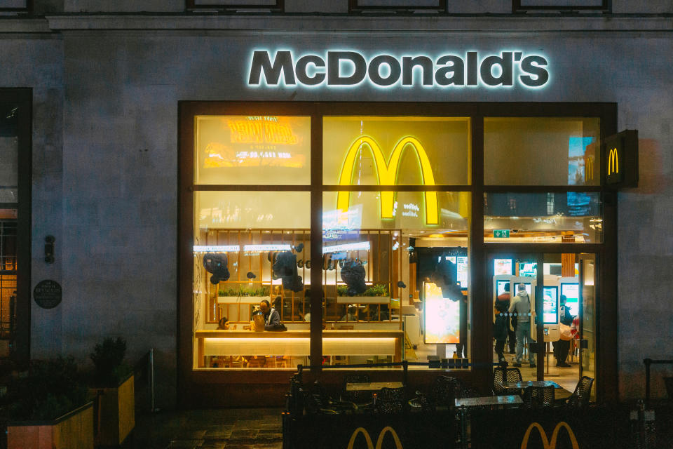 London, UK - 29 March, 2023: exterior of a McDonald's fast food restaurant in Leicester Square in London, UK, illuminated at night.