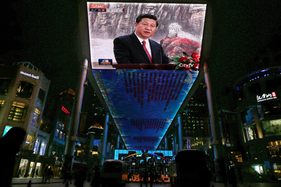 FILE - In this Nov. 15, 2012 file photo, a huge screen shows a broadcast of China's new Communist Party General Secretary Xi Jinping speaking in Beijing's Great Hall of the People. Xi is highlighting corruption as a scourge that could bring down the Communist Party, though he has yet to offer any specific new proposals to stop it. In a weekend speech that was carried Monday, Nov. 19, by the official Xinhua News Agency, Xi told the new 25-member Politburo that the party must be vigilant against graft, noting that corruption in other countries in recent years has prompted major social unrest and the collapse of governments. (AP Photo/Vincent Yu, File)