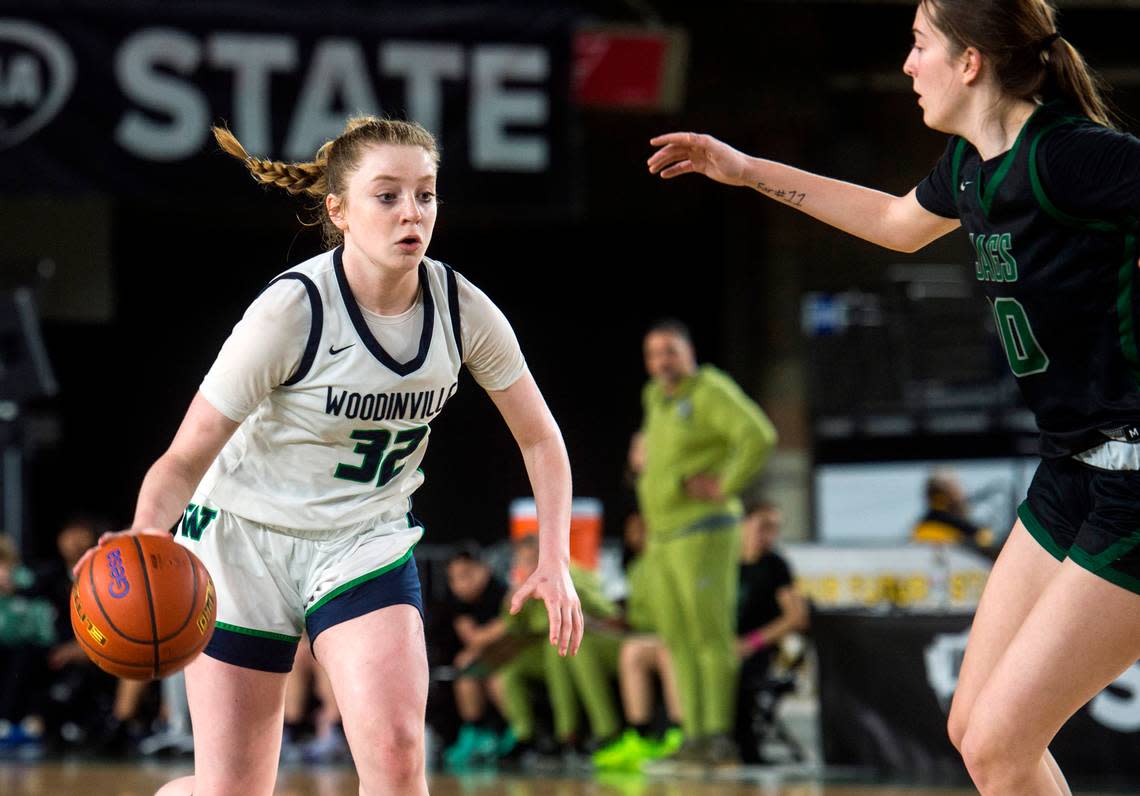 Woodinville guard Brooke Beresford (32) brings the ball up the court against Emerald Ridge in the fourth-sixth place game of the Class 4A girls state basketball tournament on Saturday, March 4, 2023 at the Tacoma Dome in Tacoma, Wash.