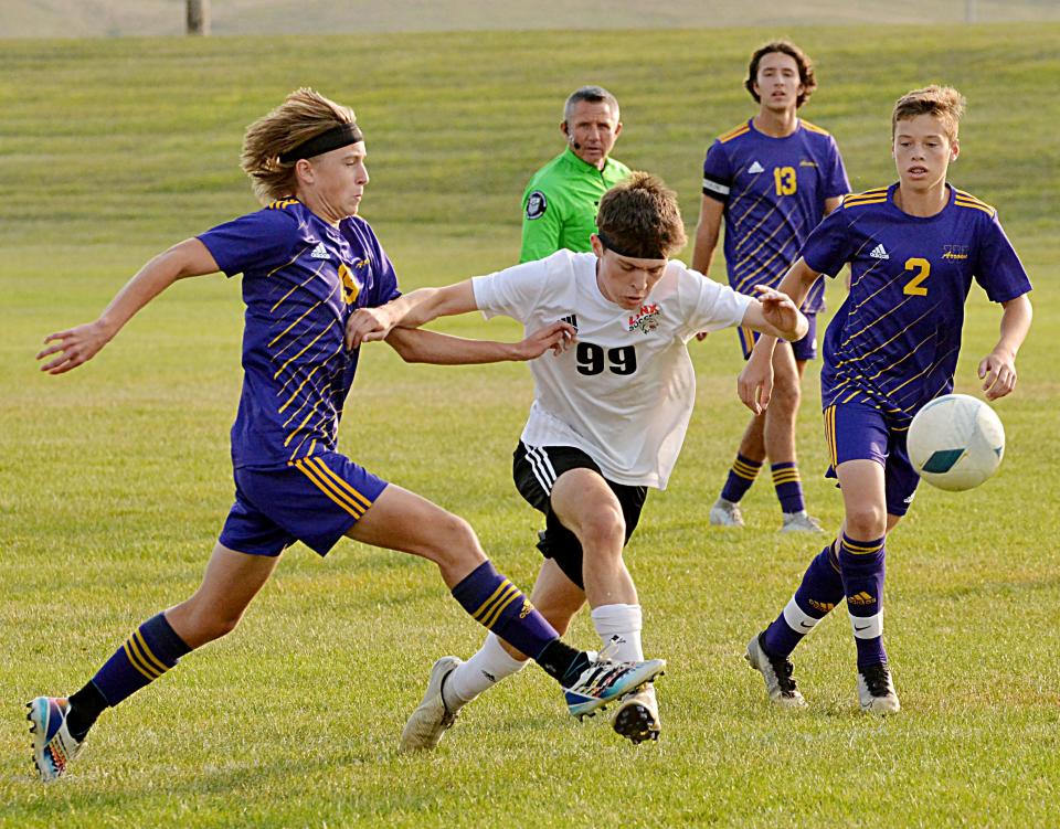 Watertown's Noah Wallenmeyer (left) knocks the ball away from Brandon Valley's Justin Vest as Arrow teammates Braxten Endres and Jaxson Fiechtner look on during their Eastern South Dakota Conference high school boys soccer match Tuesday at the ANZA Soccer Complex. Watertown won 1-0.