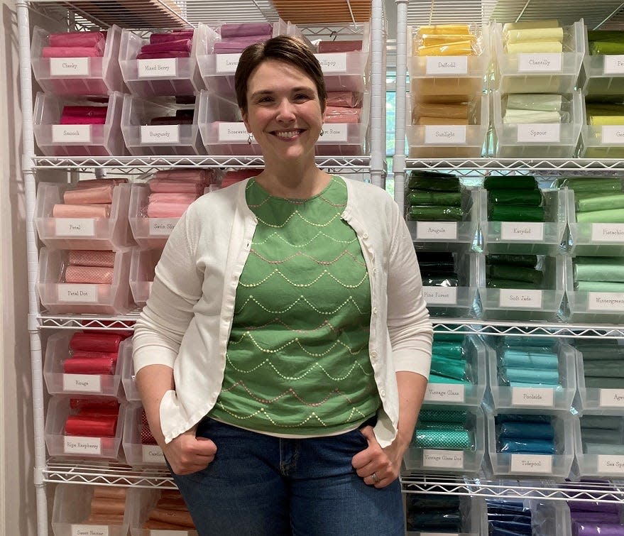 Elizabeth Jones, owner and operator of Poshta Design, inside her Granville Township work space.