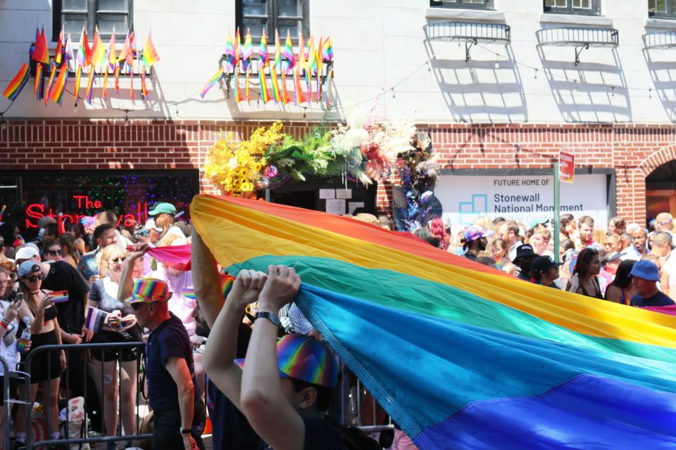 People participate in the New York City Pride Parade on Christopher Street on June 26, 2022 , in New York. The parade has been an annual tradition since it was first held in 1970 to observe the one-year anniversary of the Stonewall Uprising in Greenwich Village.