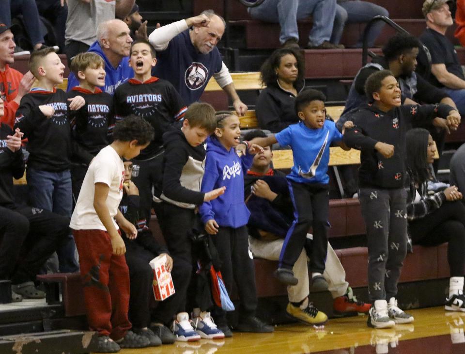 Little Aviator basketball players cheer on Alliance in a district semifinal Thursday, March 2, 2023, at Boardman High School.