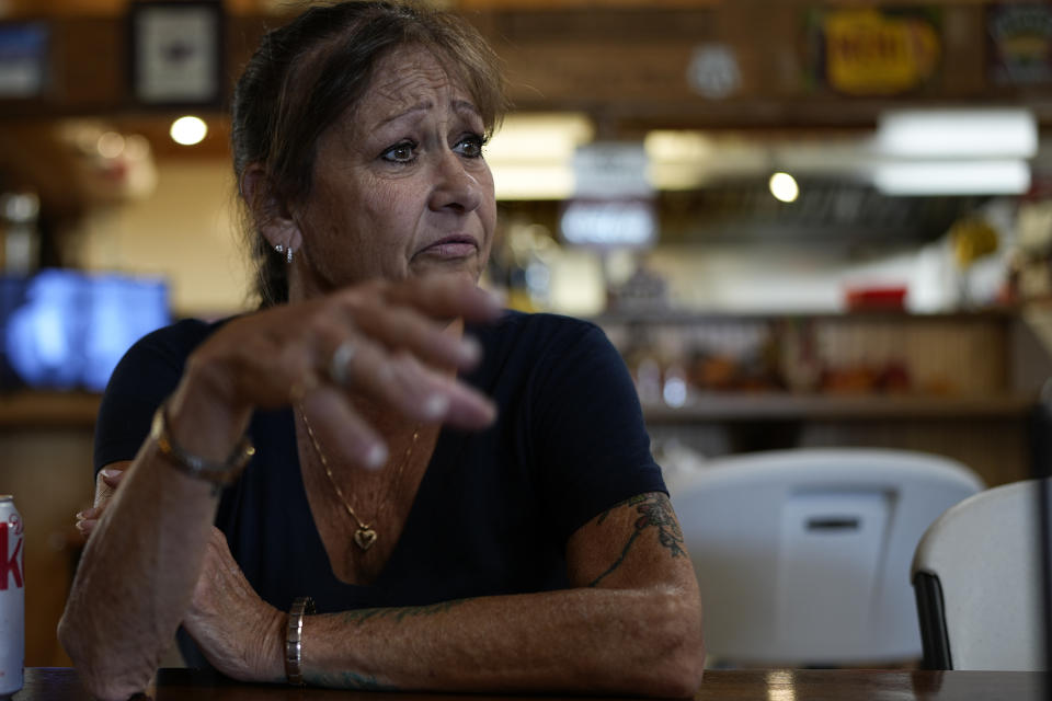 Karen Goodwin reflects on the life of her son, Austin Hunter Turner, as she rests at a roadside market during a motorcycle ride along U.S. Highway 421, Friday, Sept. 22, 2023, in Shady Valley, Tenn. Goodwin's son, Austin Hunter Turner, died in 2017 after an encounter with the Bristol Police Department. (AP Photo/George Walker IV)