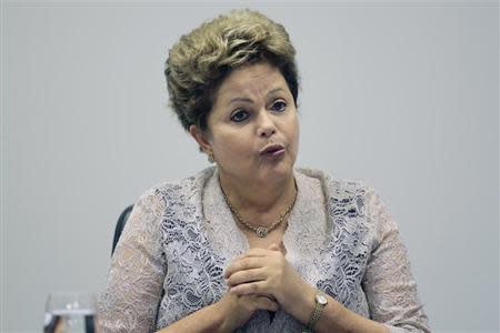 Brazil's President Dilma Rousseff speaks during the first meeting of the newly-formed CIASN, an interministerial committee for simplifying tax collection, at the Planalto Palace in Brasilia, February 12, 2014. REUTERS/Ueslei Marcelino