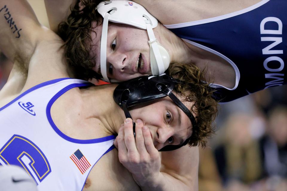 Edmond North's Kody Routledge, top, wrestles Stillwater's Landyn Sommer in the Class 6A 157-pound match during the high school state wrestling tournament championships at State Fair Arena in Oklahoma City, Saturday, Feb. 24, 2024.