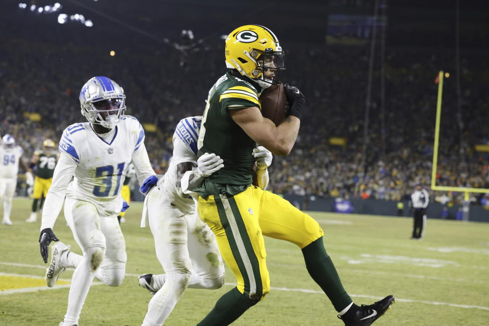 FILE Green Bay Packers wide receiver Allen Lazard (13) catches a touchdown pass during an NFL football game against the Detroit Lions Sunday, Jan. 8, 2023, in Green Bay, Wis. The New York Jets signed former Green Bay Packers wide receiver Allen Lazard to a four-year contract Friday, March 17, 2023. (AP Photo/Jeffrey Phelps, File)