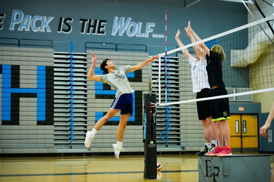 Ryan Bugs jumps up for a hit during practice with the Estrella Foothills High School boys' volleyball team on March 27, 2023, in Goodyear, Ariz.