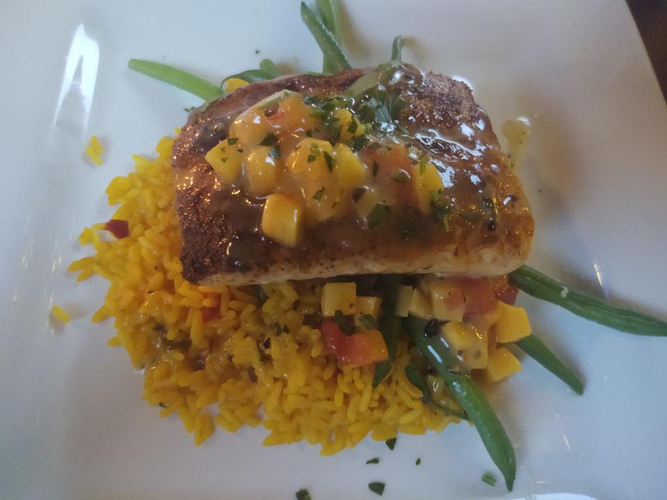 At Chill & Grill in Vero Beach, the blackened mahi has a fruity sauce finish, saffron rice and green beans.
