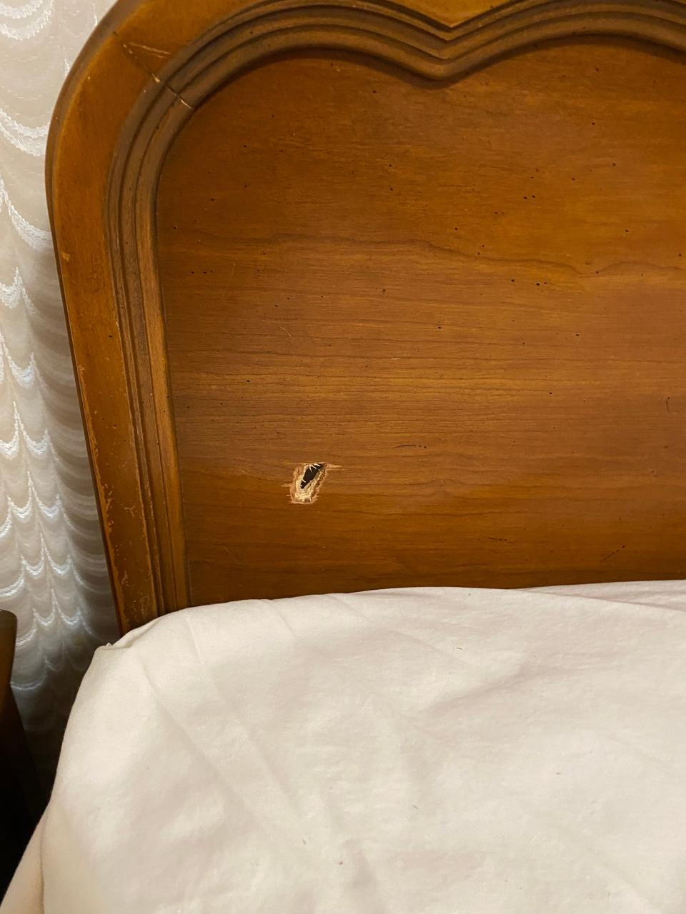 A bullet went through Helen Arnold Principal LaMonica Davis's mother's house in Akron on New Year's, slicing through the headboard of her bed.