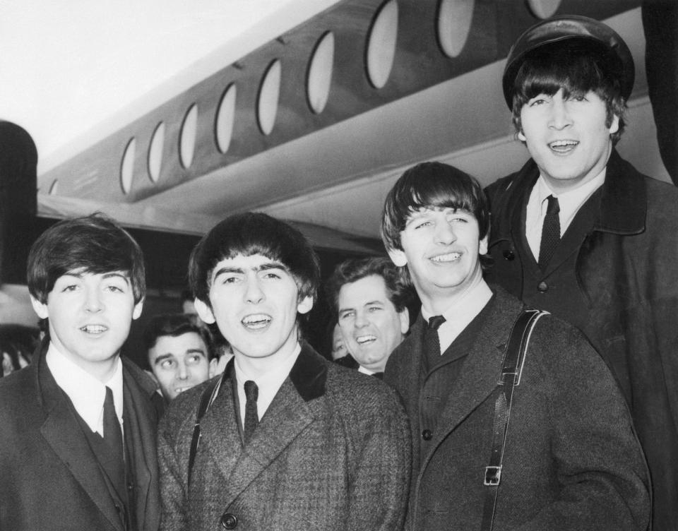 The Beatles: (left to right) Paul McCartney; George Harrison, Ringo Starr, and John Lennon on their arrival in 1964 at Heathrow Airport from Paris where they appeared at the Olympia Music Hall.