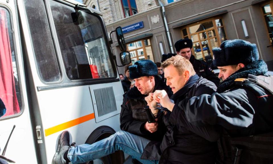 Opposition leader Alexei Navalny is arrested during a rally in Moscow.