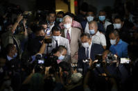 FILE - Former Malaysian Prime Minister Najib Razak, center, leaves a court house in Kuala Lumpur, Malaysia on July 28, 2020. Malaysia’s Appeal Court on Wednesday, Dec. 8, 2021, upheld the conviction of ex-Prime Minister Najib Razak linked to the massive looting of the 1MDB state investment fund that brought down his government in 2018. (AP Photo/Vincent Thian, File)