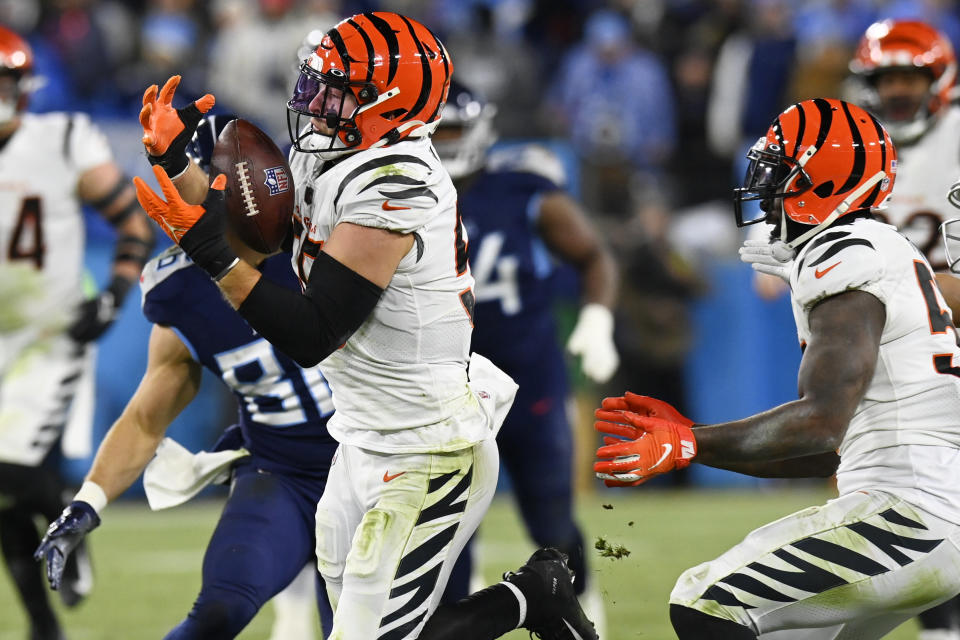 Cincinnati Bengals linebacker Logan Wilson (55) intercepts the ball against the Tennessee Titans during the second half of an NFL divisional round playoff football game, Saturday, Jan. 22, 2022, in Nashville, Tenn. The Cincinnati Bengals won 19-16. (AP Photo/Mark Zaleski)