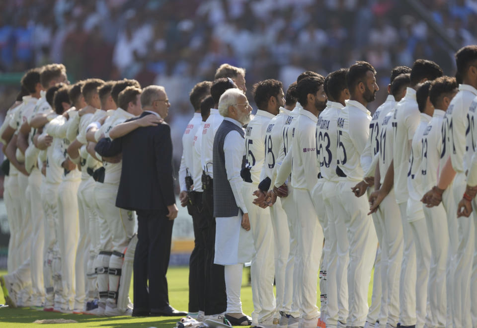 Indian Prime Minister Narendra Modi with his Australian counterpart Anthony Albanese stand with their respective countries team for national anthems at the start of the fourth cricket test match between India and Australia in Ahmedabad, India, Thursday, March 9, 2023. (AP Photo/Ajit Solanki)