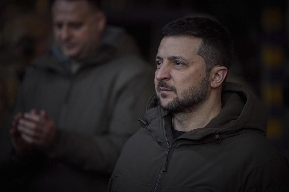 In this photo provided by the Ukrainian Presidential Press Office, Ukrainian President Volodymyr Zelenskyy, looks on as he meets soldiers at the site of the heaviest battles with the Russian invaders in Bakhmut, Ukraine, Tuesday, Dec. 20, 2022. (Ukrainian Presidential Press Office via AP)