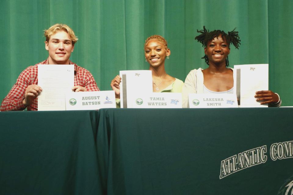 August Batson, Tamia Waters, and Lakesha Smith (left to right) signed their Letters of Intent in a signing ceremony at Atlantic High on Wednesday, April 12.