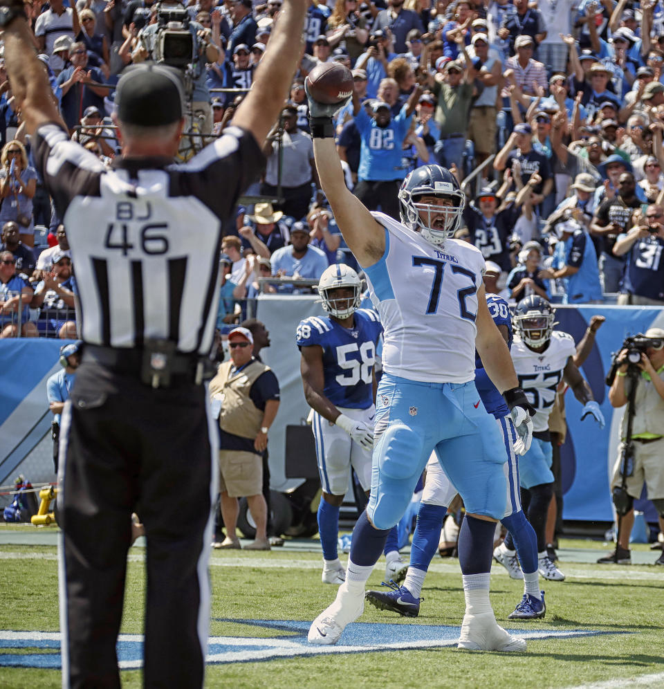 Tennessee Titans tackle David Quessenberry celebrates his second-quarter touchdown catch. (Getty Images)