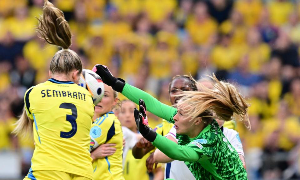 <span>The England goalkeeper Hannah Hampton attempts a clearance under pressure from Linda Sembrant.</span><span>Photograph: Björn Larsson Rosvall/TT News Agency/AFP/Getty Images</span>