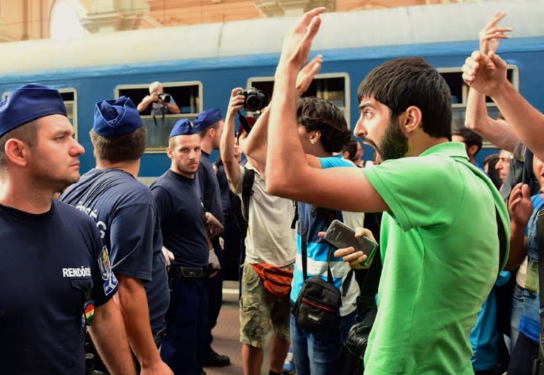 Migrants protest at Keleti railway station in Budapest on September 1, 2015 during its evacuation by local police