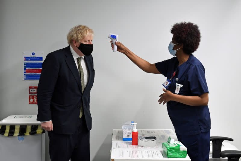 Britain's Prime Minister Boris Johnson visits the Chase Farm Hospital in north London