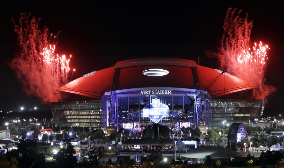 Pyrotechnics are fired off the top of AT&T Stadium at the end of the third round of the NFL football draft Friday, April 27, 2018, in Arlington, Texas. (AP Photo/Eric Gay)