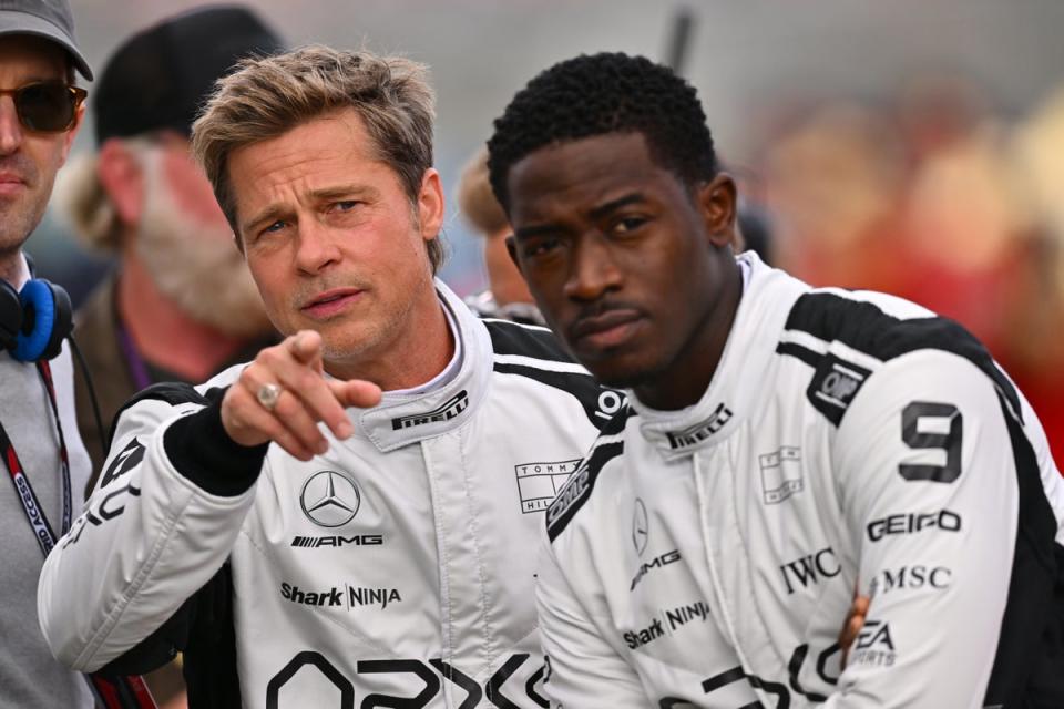 Brad Pitt alongside Damson Idris, filming the new Formula 1 film at Silverstone in July (Getty Images)