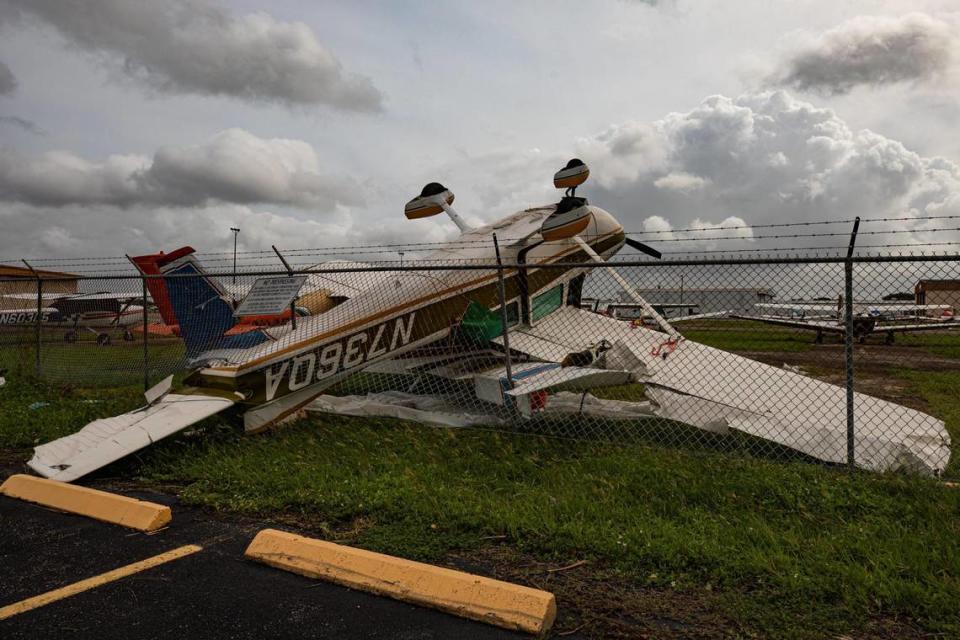 An airplane is seen flipped over due to winds produced by Hurricane Ian at North Perry Airport in Pembroke Pines, Florida on Wednesday, September 28, 2022.