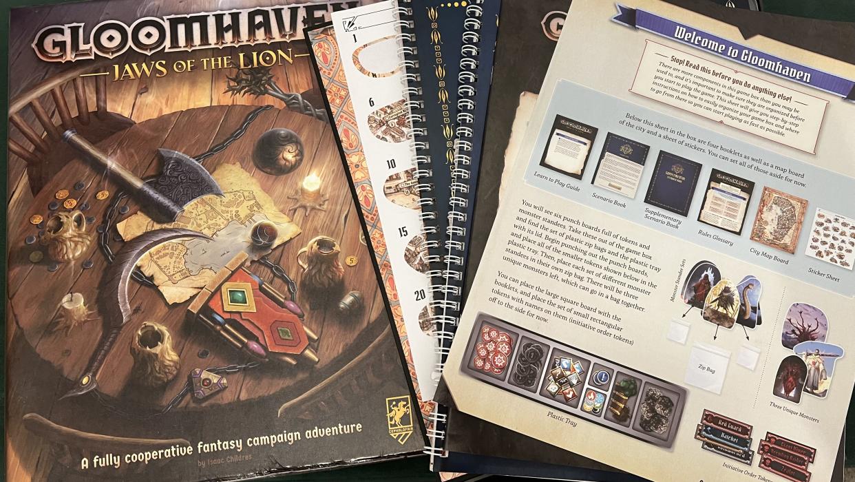  Gloomhaven: Jaws of the Lion box with game documentation . 