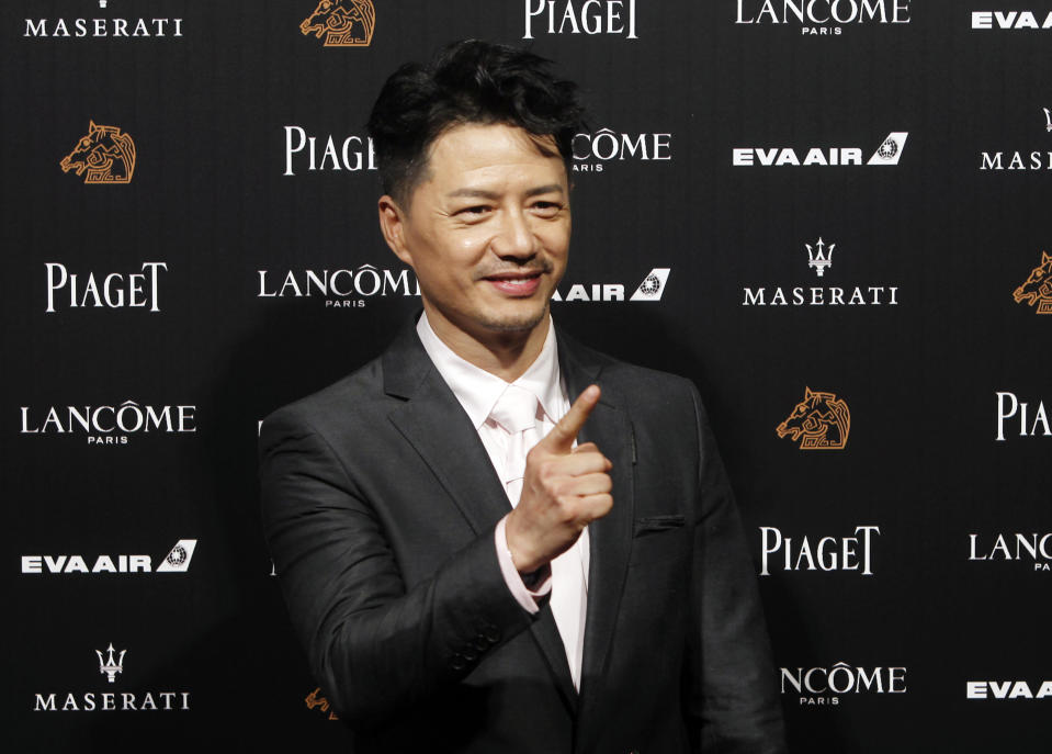 Chinese actor Duan Yihong arrives at the 55th Golden Horse Awards in Taipei, Taiwan, Saturday, Nov. 17, 2018. Duan is nominated for Best Leading Actor for the film "The Looming Storm" at this year's Golden Horse Awards -one of the Chinese-language film industry's biggest annual events. (AP Photo/Chiang Ying-ying)