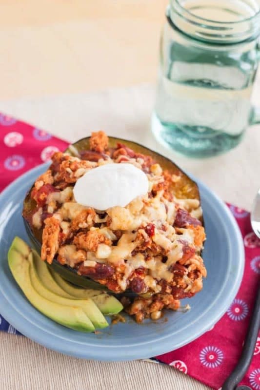 <p>Cupcakes & Kale Chips</p><p>On fall busy weeknights, you can be quickly make and eat this smoky, spicy acorn squash stuffed to the gills with garlic, turkey chili, and topped with cheese. </p><p><strong>Get the recipe: <a href="https://cupcakesandkalechips.com/turkey-chili-stuffed-acorn-squash/" rel="nofollow noopener" target="_blank" data-ylk="slk:Fire Roasted Garlic Turkey Chili Stuffed Acorn Squash;elm:context_link;itc:0;sec:content-canvas" class="link ">Fire Roasted Garlic Turkey Chili Stuffed Acorn Squash</a></strong></p>