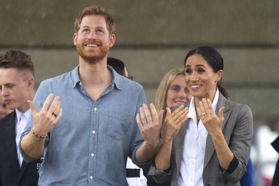 Meghan Markle and Prince Harry in the rain